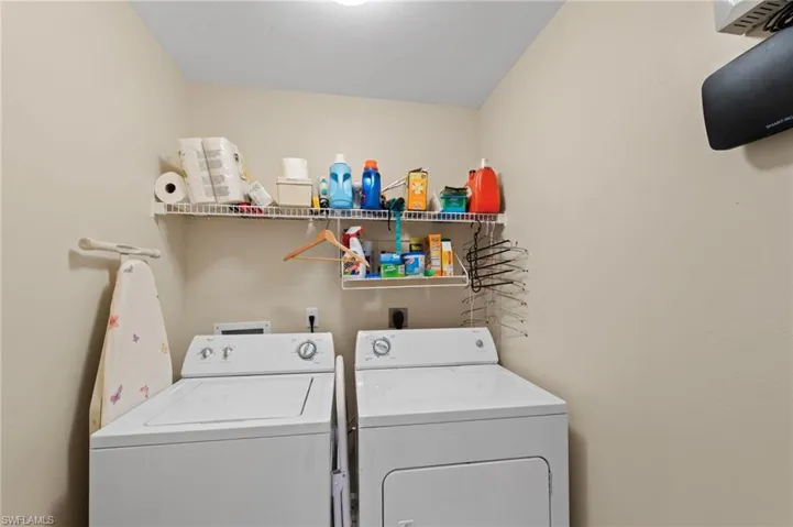 Laundry room with washing machine and clothes dryer
