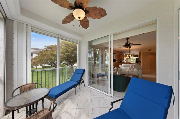 Sunroom / solarium featuring a ceiling fan