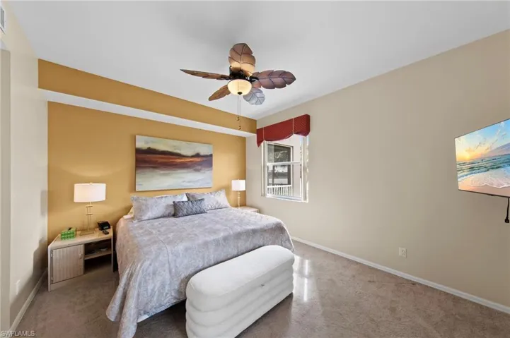 Bedroom featuring carpet and ceiling fan