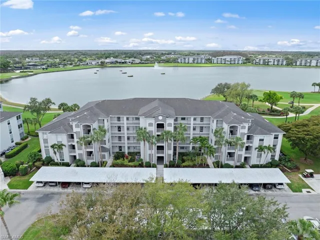 Bird's eye view of a golf course and a nearby body of water