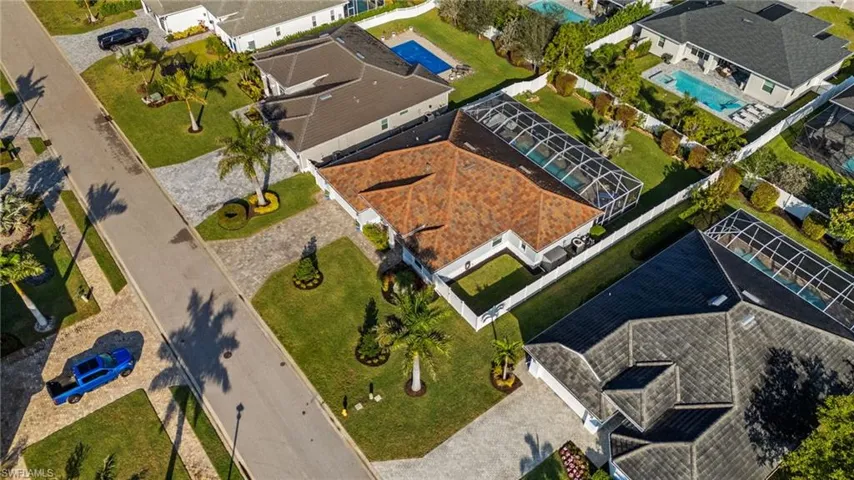 Aerial view of residential area featuring a pool