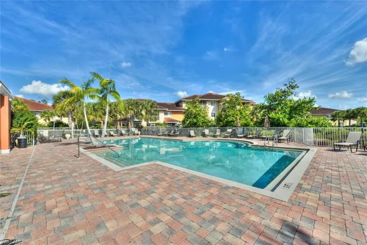 Community pool featuring a patio area