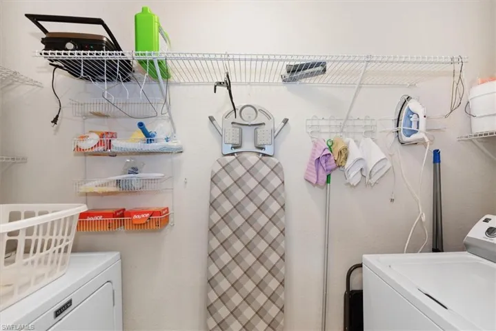 Washroom featuring washer and dryer