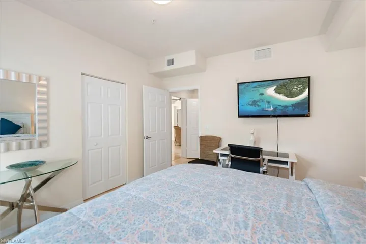 Bedroom with a closet and baseboards