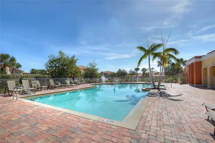 Community pool featuring a patio