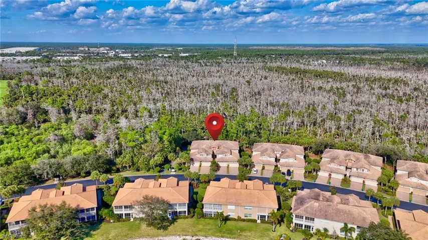 Aerial perspective of suburban area with a heavily wooded area