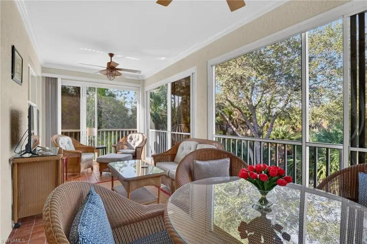 Sunroom / solarium featuring ceiling fan and outdoor lounge area