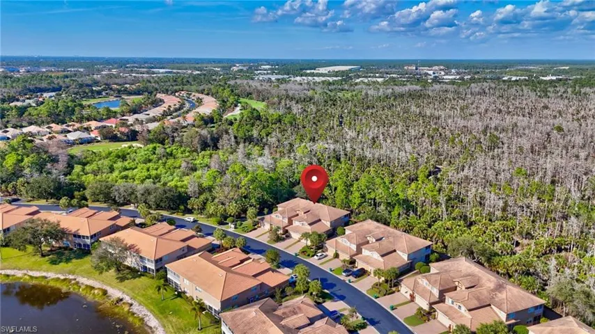 Aerial view of residential area with a nearby body of water