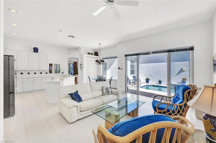 Living room and kitchen are open to one another.