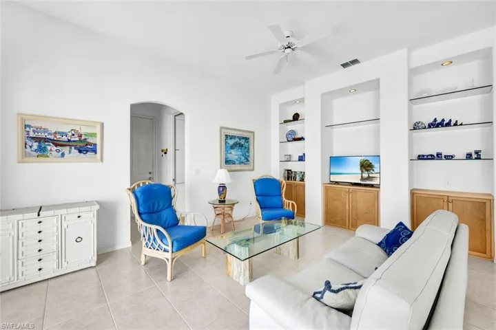 Elegant and spacious living area with high ceilings and abundant natural light.
