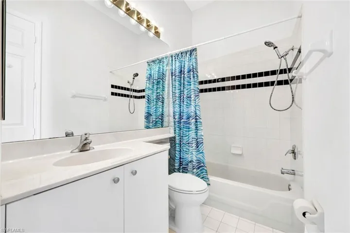 Guest bathroom with shower and tub combo.