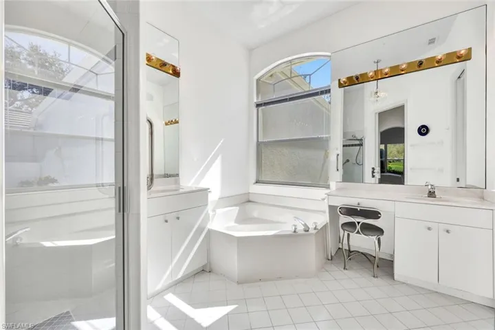 Primary ensuite features a walk-in shower, soaking tub and dual vanities.