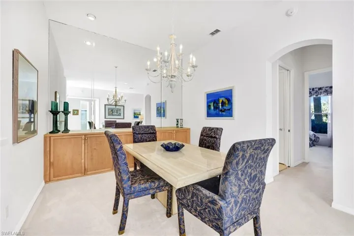 Spacious formal dining area is open to the living room.