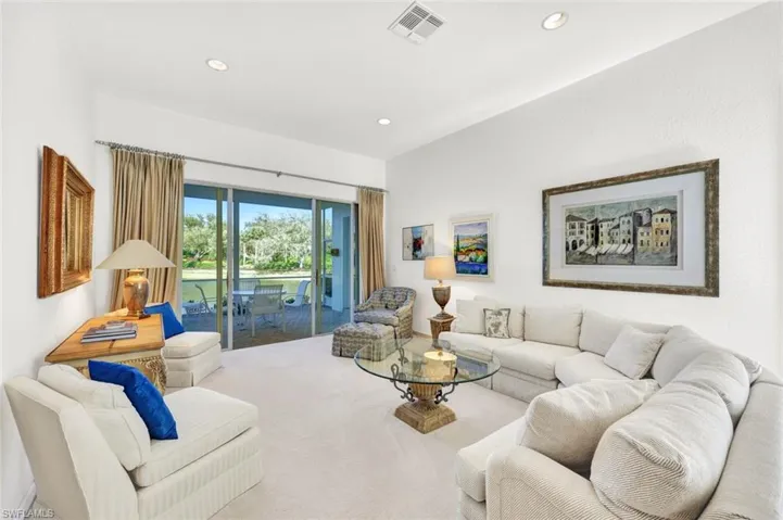 Relax after a day well-spent pool side...access the lanai from the living area.