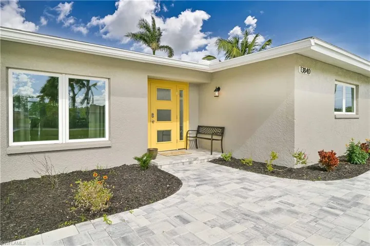 Property entrance with stucco siding