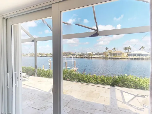 Doorway to outside with a water view