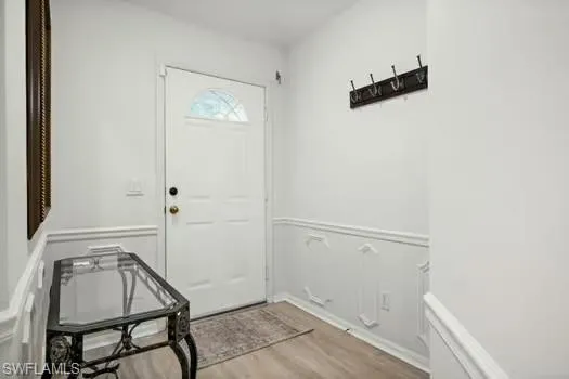 Entrance foyer featuring light wood finished floors
