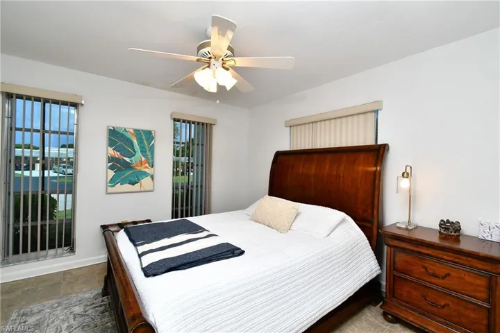 Tiled bedroom with ceiling fan
