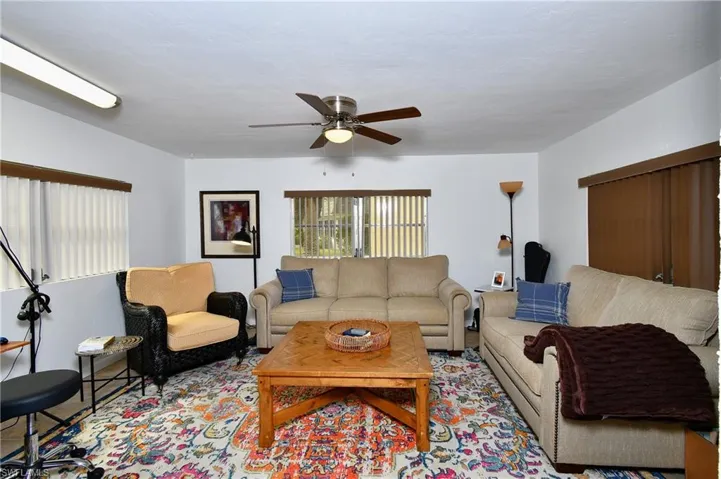 Living room featuring ceiling fan