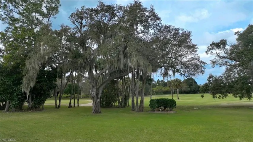 View of home's community featuring a yard