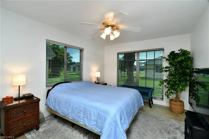 Tiled bedroom with ceiling fan