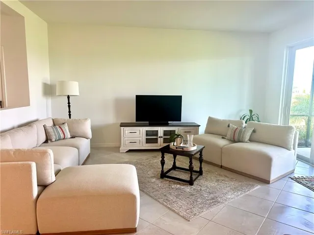 Living area featuring light tile patterned flooring