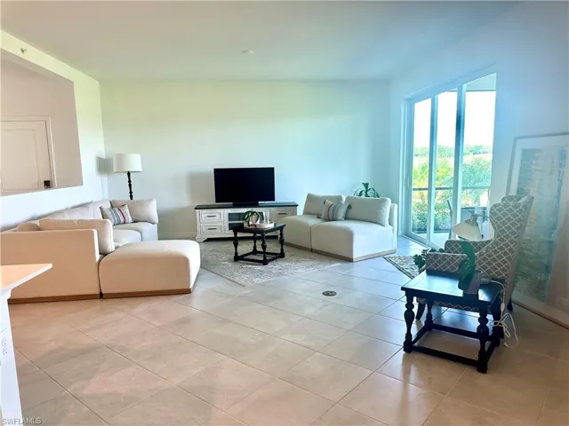 Living area with light tile patterned flooring