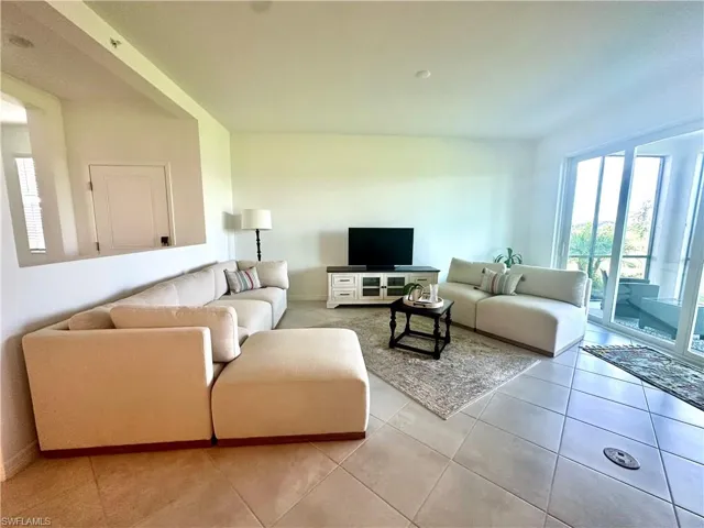 Living area featuring light tile patterned flooring