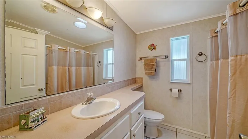 Hall bath has linen closet & skylight