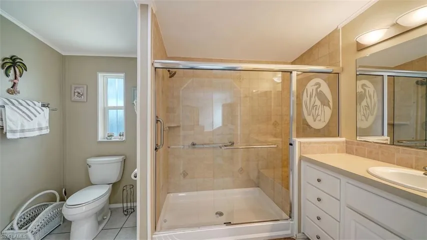 Master bathroom has glass shower & skylight