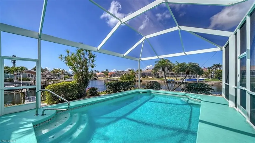Heated pool overlooking a wide canal