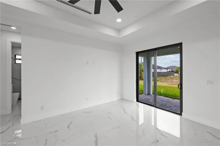 Unfurnished room with baseboards, recessed lighting, marble finish floor, and ceiling fan