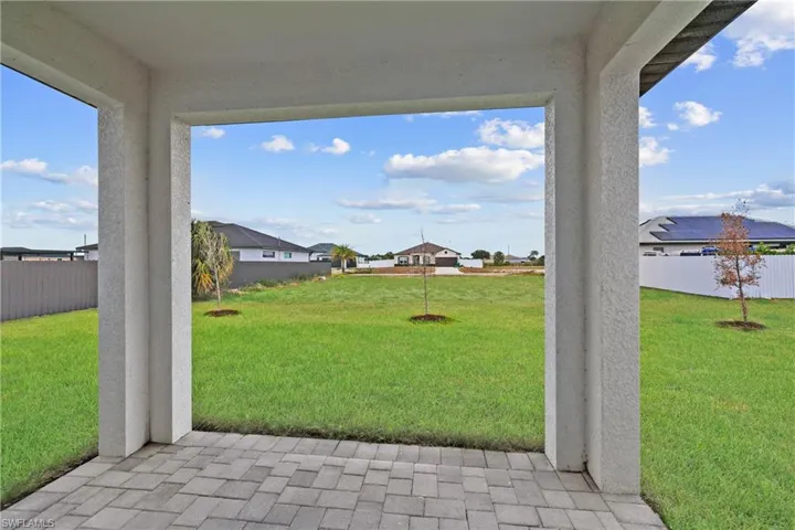View of yard with a fenced backyard and a residential view