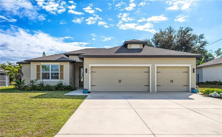 View of front of property featuring concrete driveway, stucco siding, a front yard, an attached garage, and a shingled roof