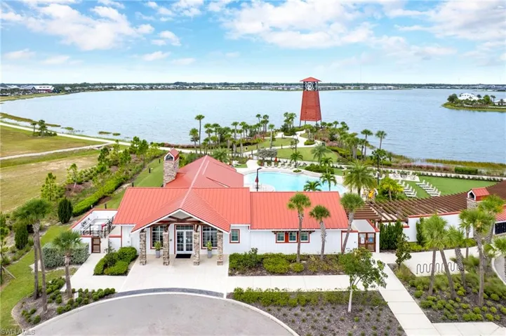 Drone / aerial view of a nearby body of water and a notable bridge