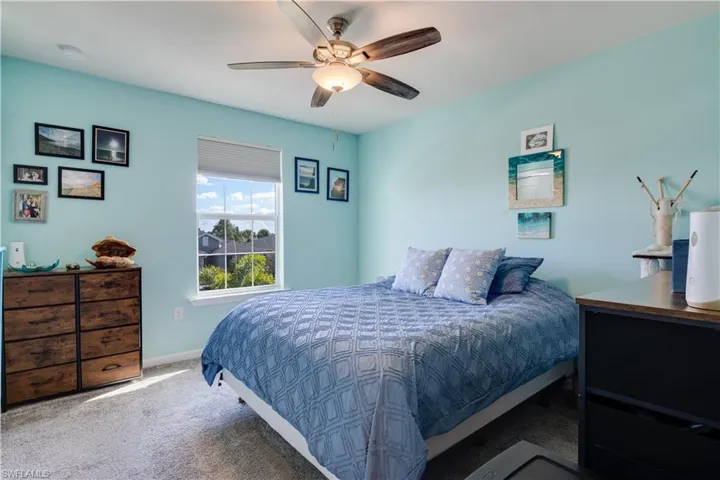 Bedroom with carpet and a ceiling fan