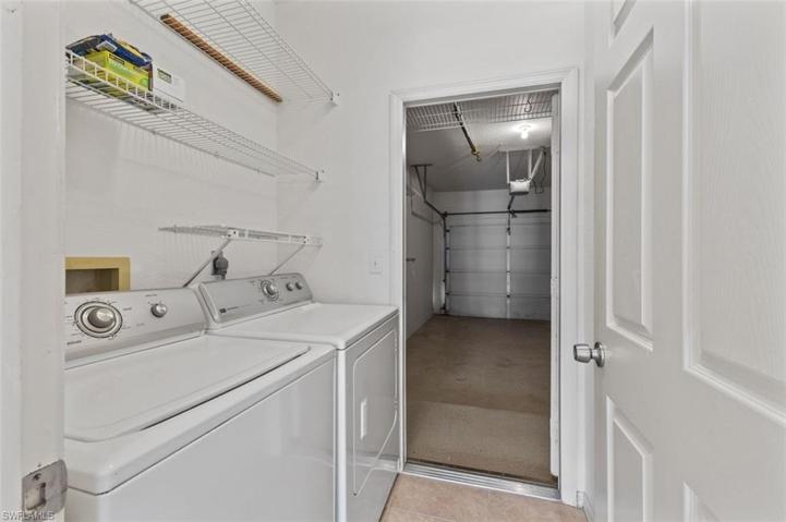 View from laundry room leading to spacious, one car garage
