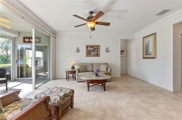 Spacious living room with sliders to sunkissed lanai