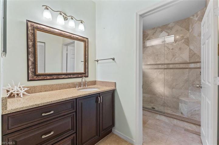 Gorgeous, recently renovated master bathroom with oversized , walk-in shower, beautifully tiled and window for natural sunlight