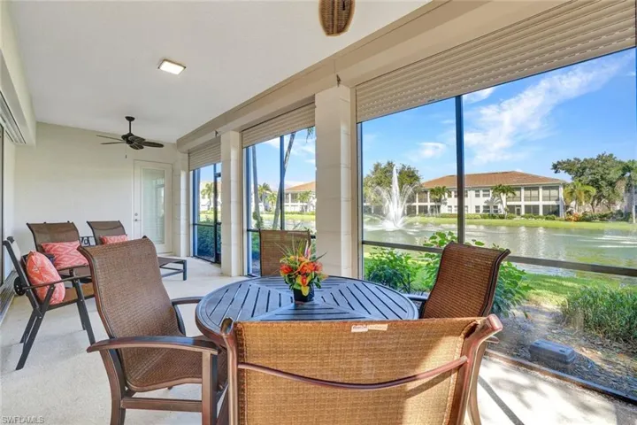 L-shaped Lanai with fully pocketing doors overlooking lake