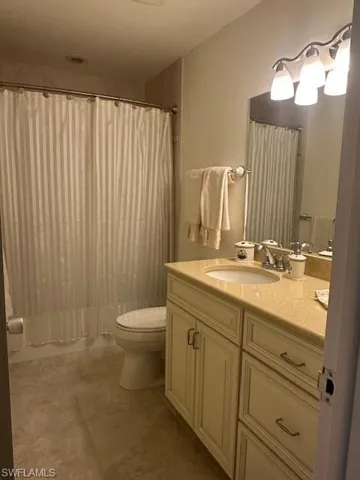 Full bathroom featuring vanity and toilet