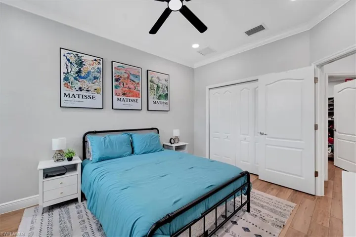 Vaulted ceiling, wood-finish flooring, ceiling fan, bi-fold closet doors, and recessed lighting