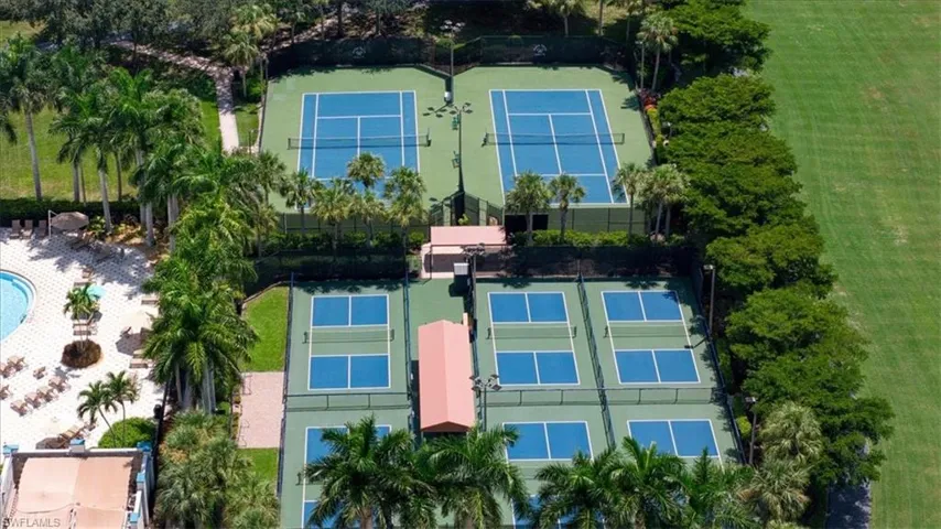 Four tennis courts, four pickleball courts, and a resort-style pool with surrounding lounge areas