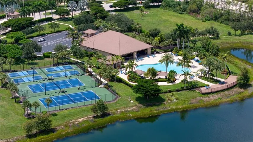 Community amenities featuring multiple tennis courts, a resort-style swimming pool, a clubhouse, and surrounding landscaping