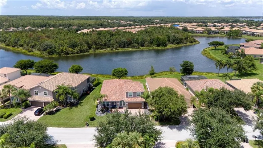 Two-story residence with a paved driveway and an attached garage