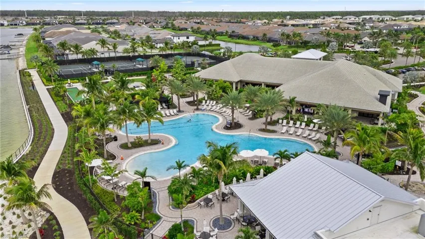 Community pool featuring a residential view and a patio