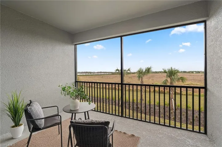 Sunroom / solarium featuring a rural view