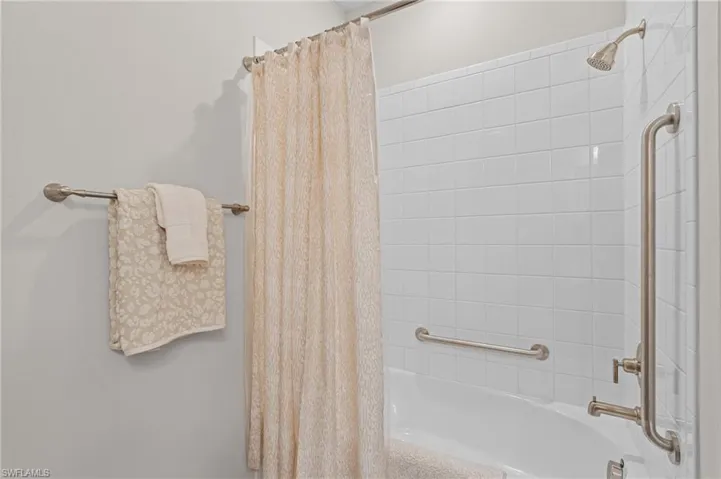 Full bath with shower / tub combo with curtain