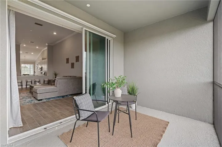 Balcony featuring a patio and visible vents