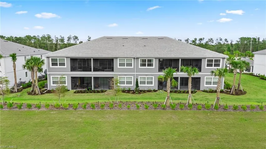 Rear view of house with a yard